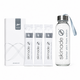 Skinade travel set featuring a clear glass water bottle with a silver cap and blue-gray strap, three individual sachets, and a white box on a clean white background.
