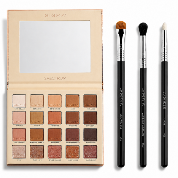 Sigma Spectrum eyeshadow palette in a beige case with 15 warm-toned shades, shown open next to three black Sigma brushes on a white background.
