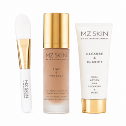 Three MZ SKIN skincare items from Dr. Maryam Zamani arranged on a white background: a white and gold applicator brush, a tinted moisturizer bottle with a gold cap, and a white and gold cleanser tube.