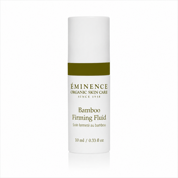 A 10 ml white bottle of Éminence Organic Skin Care Bamboo Firming Fluid with a dark olive green band and gold lettering, centered on a white background with a subtle reflection.