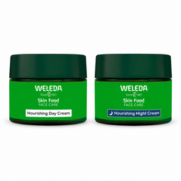 Two Weleda Skin Food Face Care cream jars side by side on a white background. The left jar is labeled 'Nourishing Day Cream' with a white label, and the right jar is labeled 'Nourishing Night Cream' with a blue label.
