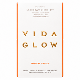 A tall rectangular box of VIDA GLOW Liquid Collagen Skin + Gut in Tropical Flavour, featuring a white front with gold foil lettering and orange side borders on a white background.