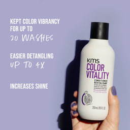 KMS Color Vitality conditioner bottle held by a hand with text on a purple background