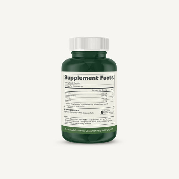 A dark green supplement bottle with a white ribbed cap, showing the Supplement Facts label on a light off-white background.