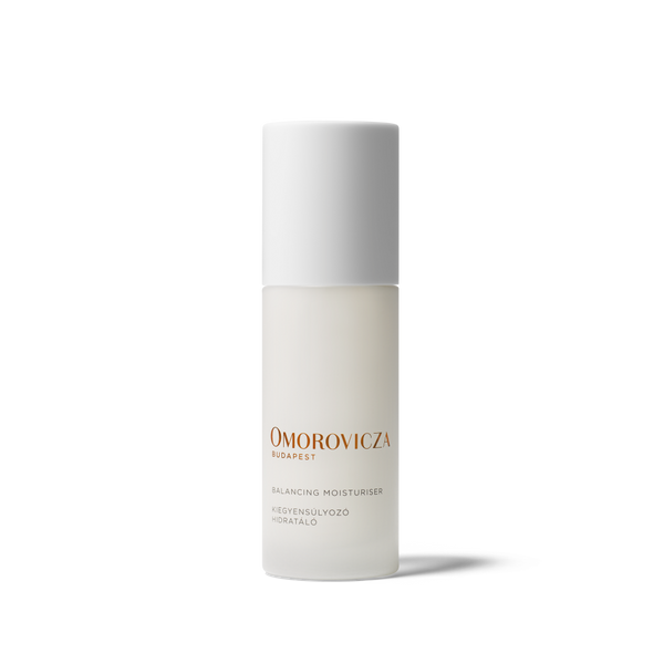 Omorovicza Skincare Balancing Moisturiser in a frosted glass bottle with a white cap, featuring gold and black text on a clean white background.