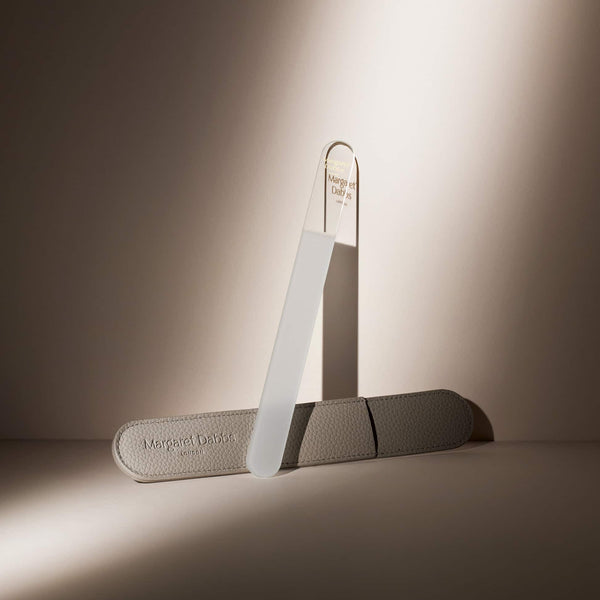 Pair of gray shoe trees on a neutral background