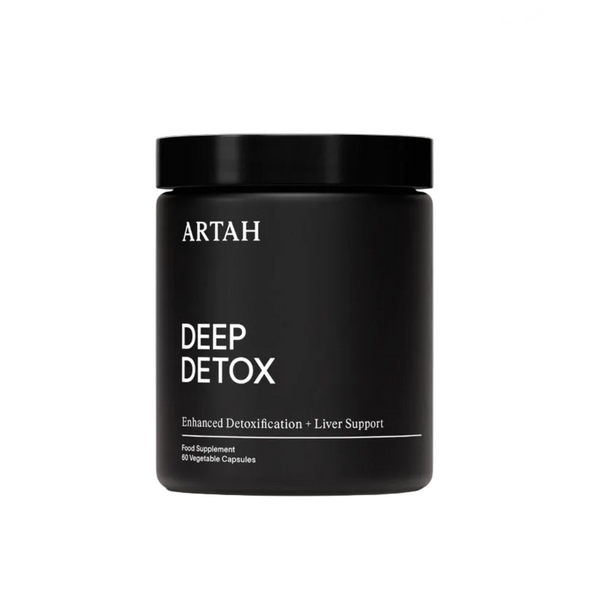 Black supplement jar labeled 'DEEP DETOX' by ARTAH on a light gray background with 'Traveller' and 'ELLE' feature logos.