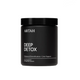 Black supplement jar labeled 'DEEP DETOX' by ARTAH on a light gray background with 'Traveller' and 'ELLE' feature logos.
