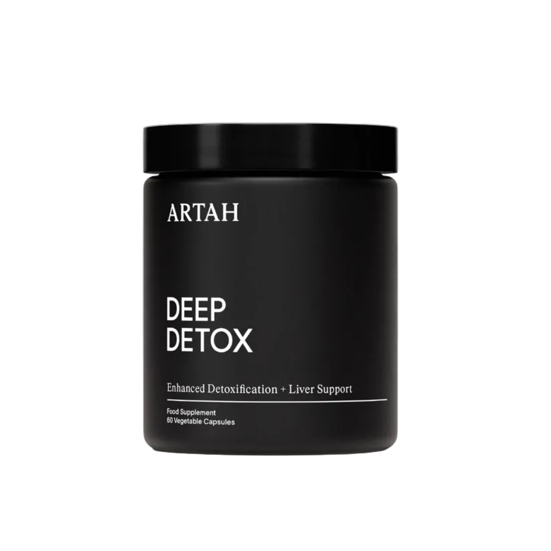 Black supplement jar labeled 'DEEP DETOX' by ARTAH on a light gray background with 'Traveller' and 'ELLE' feature logos.