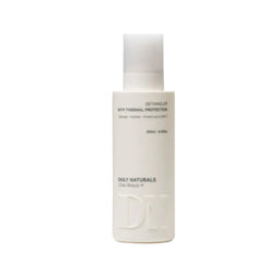 White bottle of Daily Naturals detangler on a light gray background