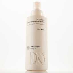 Hair care product bottle with 'Daily Naturals' branding on a white background