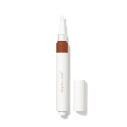 Concealer pen with brown applicator and white casing on a white background