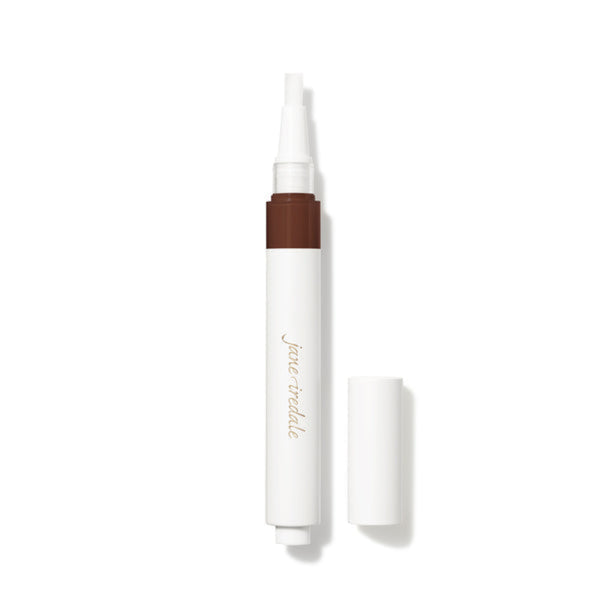 White cosmetic pen with brown tip on a white background