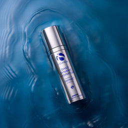 Skincare bottle labeled 'Daily Dynamic Hydrator' on a blue water background