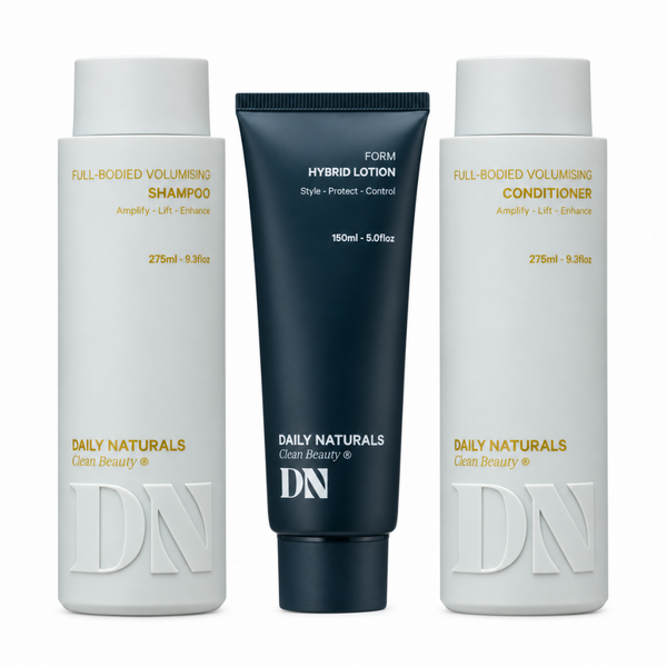 Three Daily Naturals hair care products on a white background: a white bottle of Full-Bodied Volumising Shampoo, a dark navy tube of Form Hybrid Lotion, and a white bottle of Full-Bodied Volumising Conditioner.