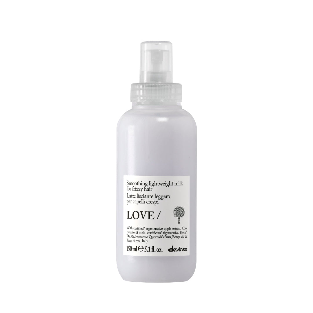 Clear spray bottle labeled 'LOVE' on a white background