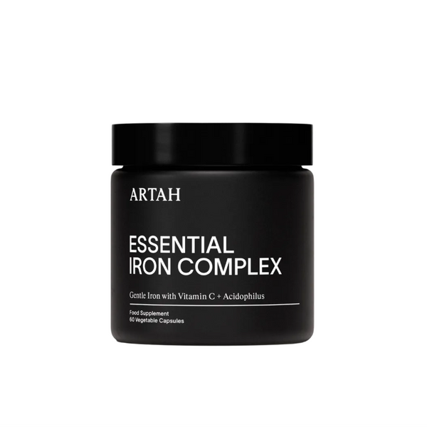 Black container of Artah Essential Iron Complex on a light gray background with a Vogue Approved badge.