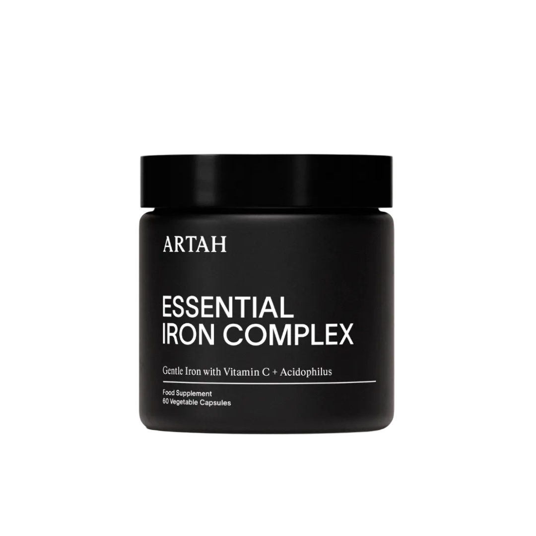 Black container of Artah Essential Iron Complex on a light gray background with a Vogue Approved badge.