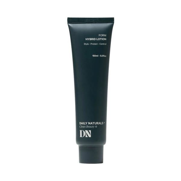 Dark green tube of 'Daily Naturals' hybrid lotion on a white background