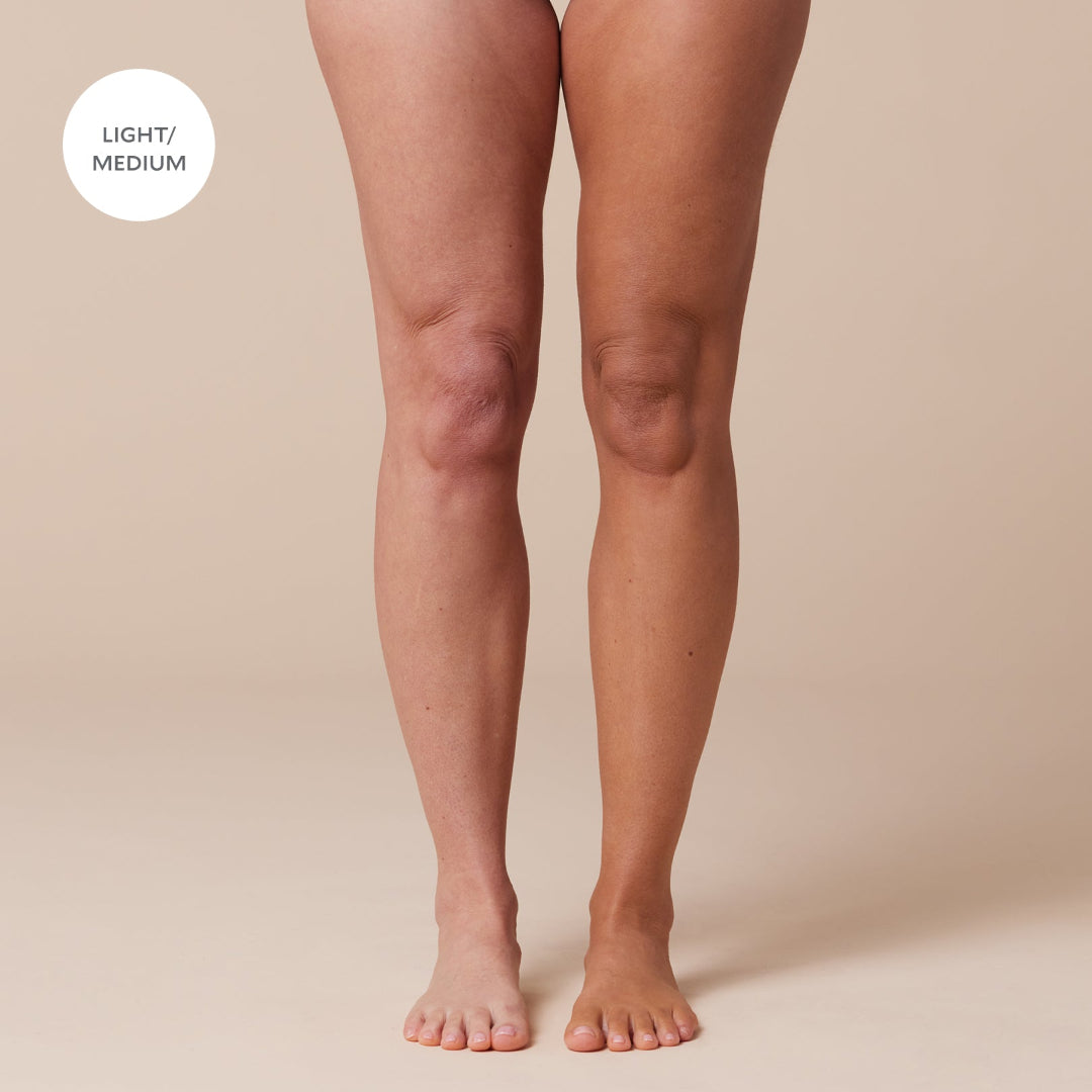 Light to medium skin tones on legs against a beige background