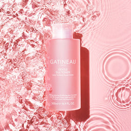 Gatineau Gentle Silk Toner 500ml in a pool of water with a pink background