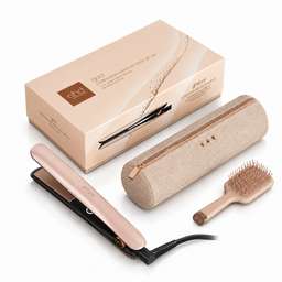 Ghda g20 hair styling set on a white background, including a rose gold flat iron, a beige fabric pouch, a wooden paddle brush, and the original packaging box.
