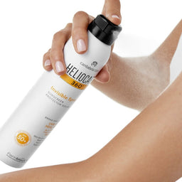 Heliocare 360 Invisible Spray SPF 50+ being sprayed onto an arm
