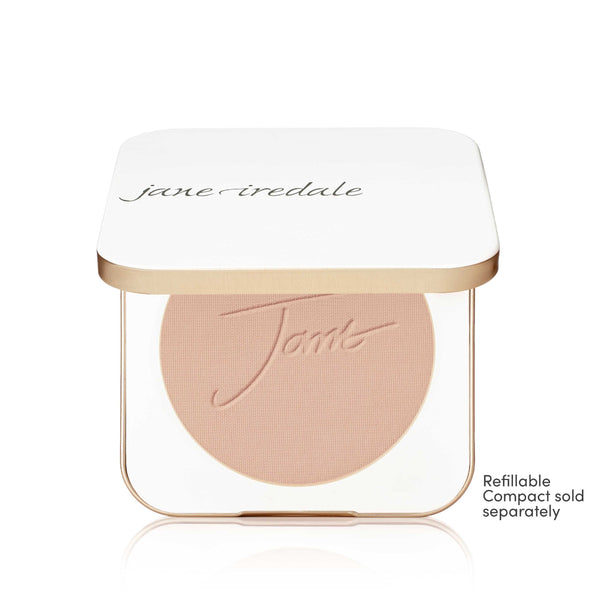 A Jane Iredale Tints refillable makeup compact shown open, revealing a circular pressed powder in a light peach-beige shade. The compact has a white lid with the brand name 'jane iredale' in black script and a gold metallic trim.
