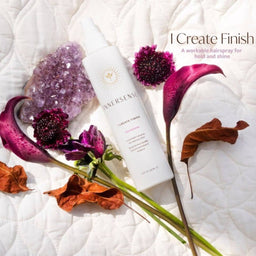 Innersense I Create Finish placed on a bed with flowers surrounding it