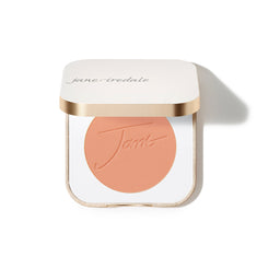 Compact powder in a white case with gold accents on a white background