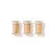 Three clear containers with gold contents on a white background