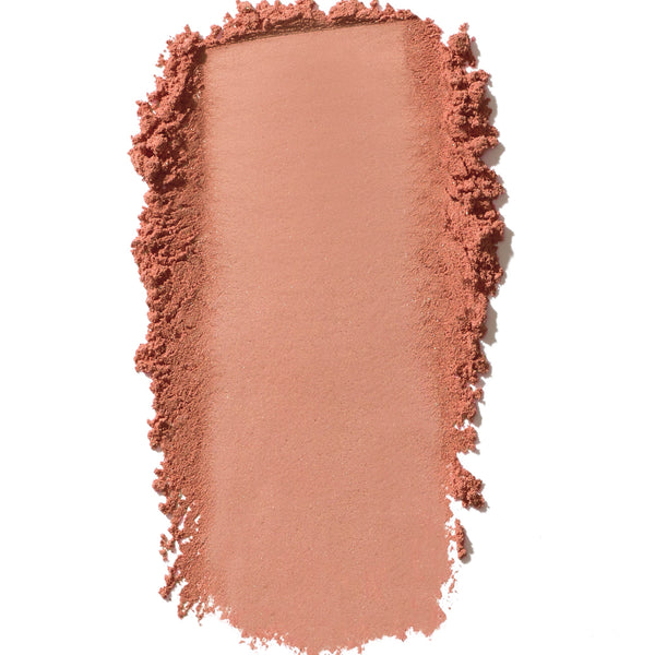 Pink makeup swatch on a white background