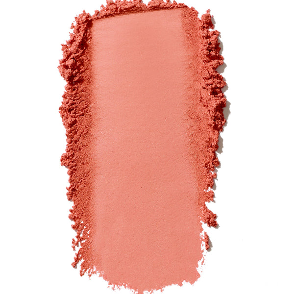 Pink makeup swatch on a white background
