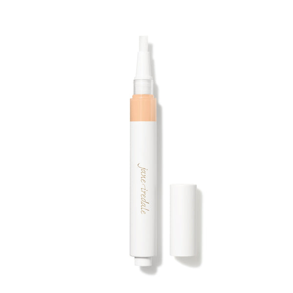 A white cosmetic pen-style applicator with a peach-colored band near the top and gold 'june teddy' branding, shown with its cap off beside it on a white background.