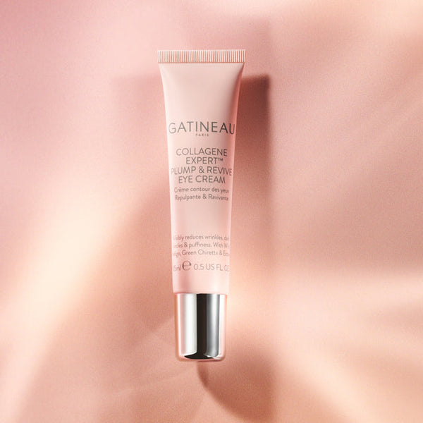 Gatineau eye cream tube on a pink gradient background