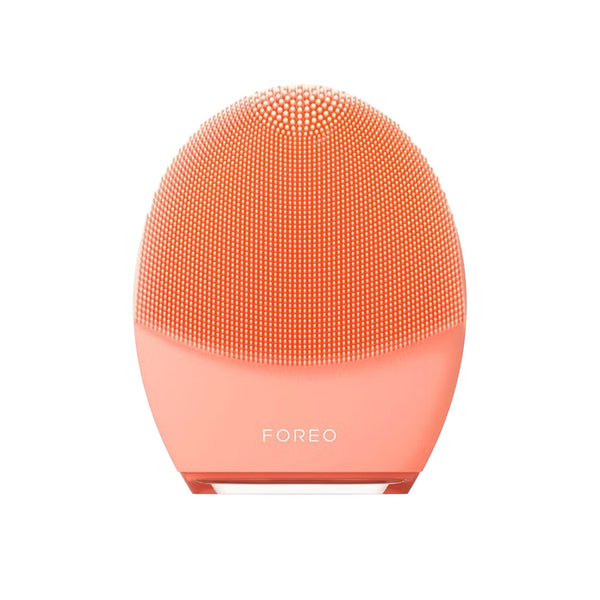 A FOREO Luna facial cleansing device in a vibrant coral orange color, shown against a solid white background.