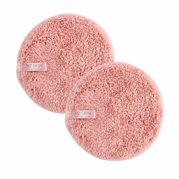 Two round pink plush makeup remover pads with a small 'MZ SKIN' label, shown on a clean white background.