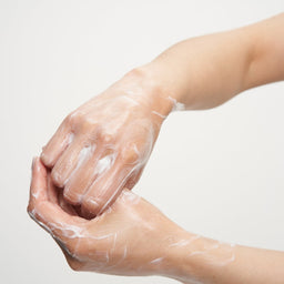 Wildsmith Skin Aluminium Hand and Body Lotion 300ml being massaged into hands