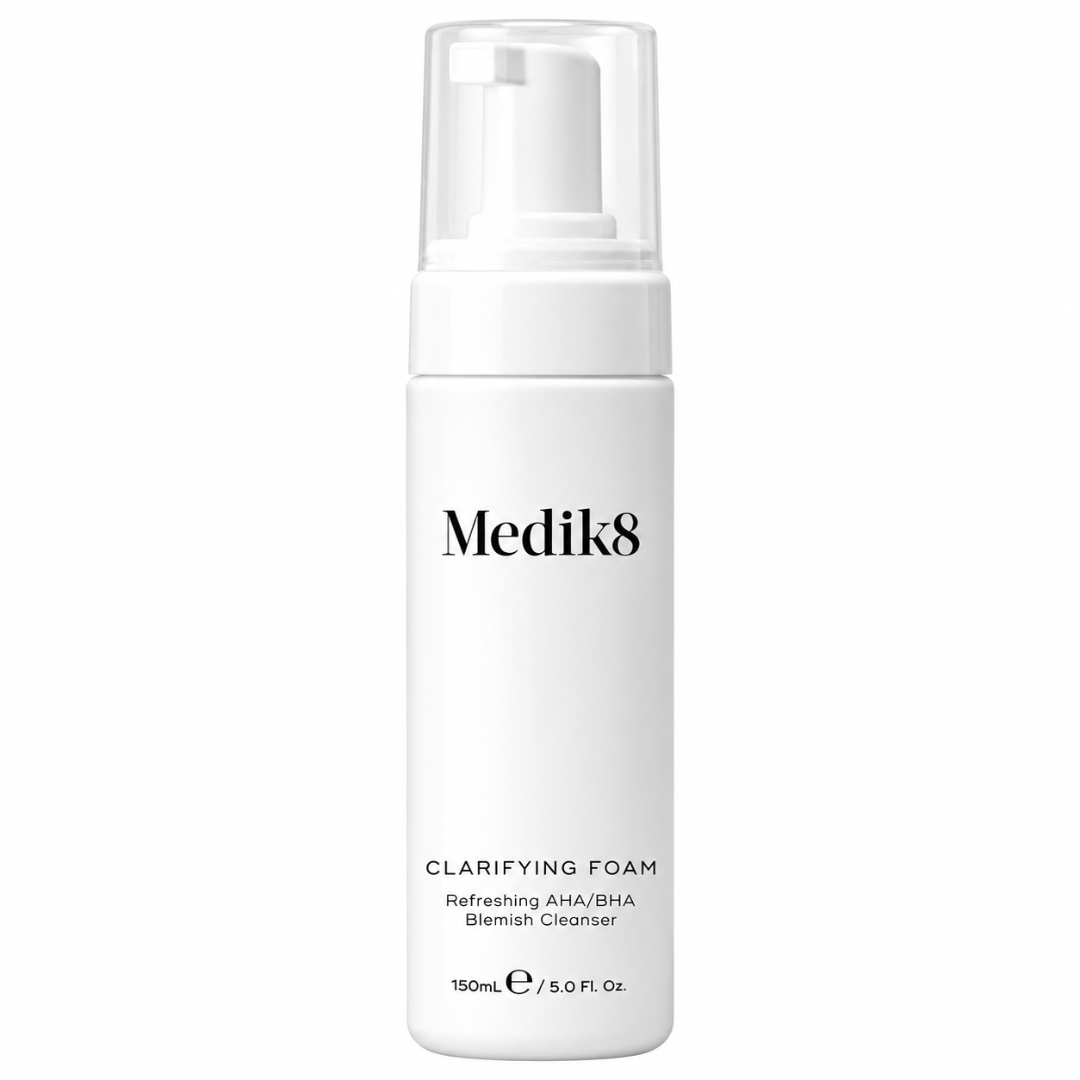 A white bottle of Medik8 Clarifying Foam with a clear pump dispenser, shown on a solid white background.