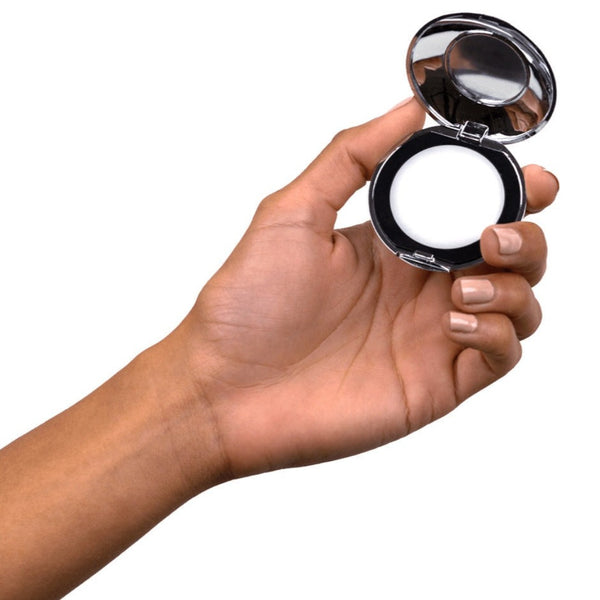Proto-col Miracle Balm mirror held in a hand