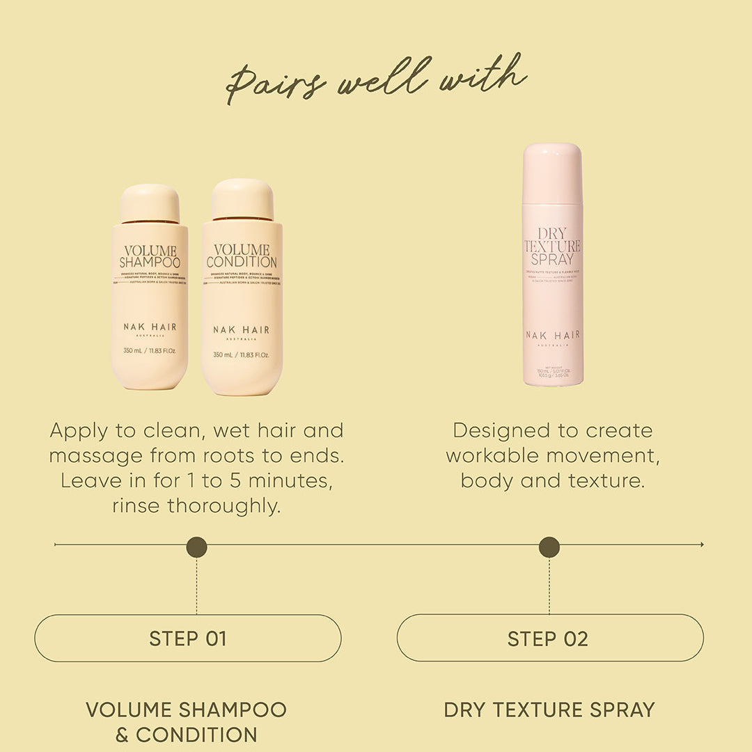 Hair care product set with shampoo, conditioner, and spray on a beige background