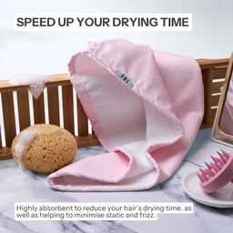 Pink hair drying cap on a marble surface with text about reducing drying time and minimizing static.