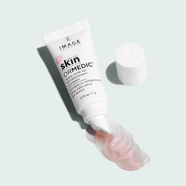 Image Skincare Ormedic Sheer Pink Lip Enhancement Complex tube with the contents poured out 