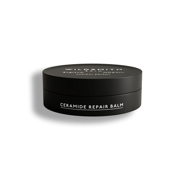 A black cylindrical jar of Wildsmith Ceramide Repair Balm with white text, shown on a clean white background with a soft shadow.