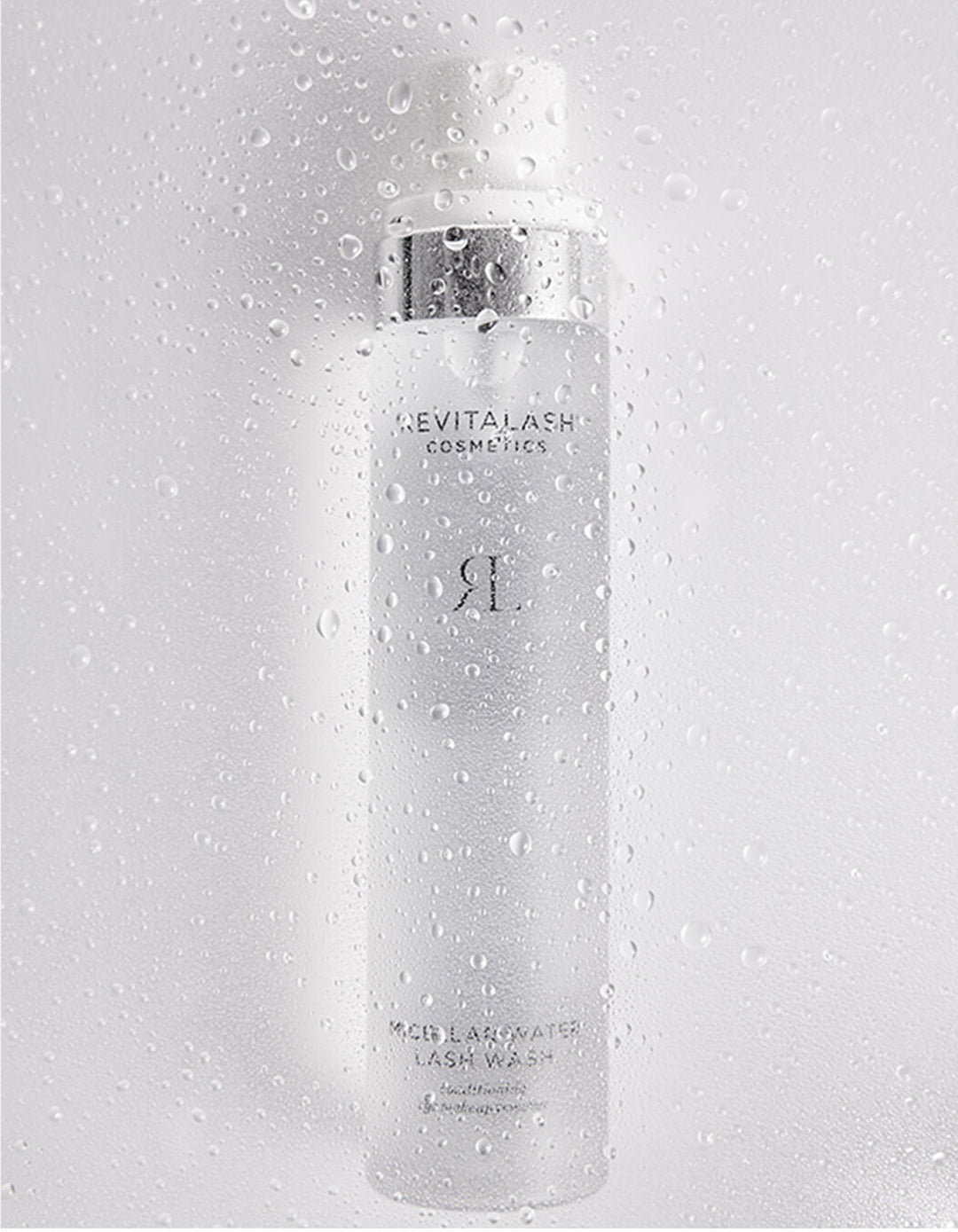 Revitalash cosmetic bottle on a gray background