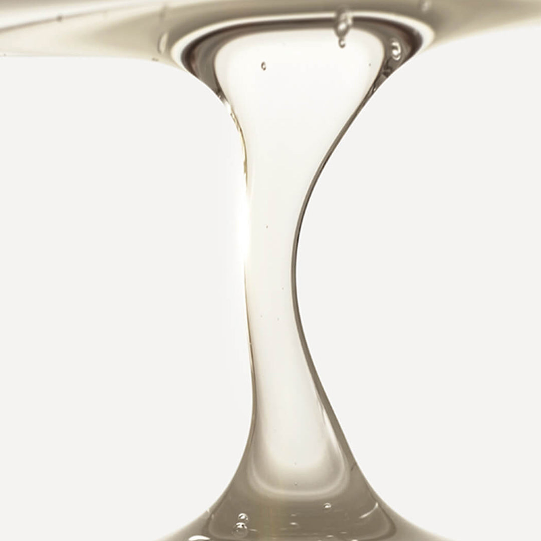 Close-up of a glass vase with a smooth, reflective surface.