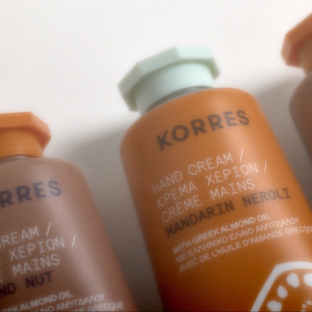 Korres hand cream bottles on a white background