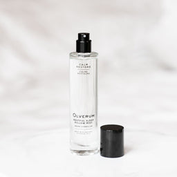a bottle of Olverum Restful Sleep Pillow Mist with no lid