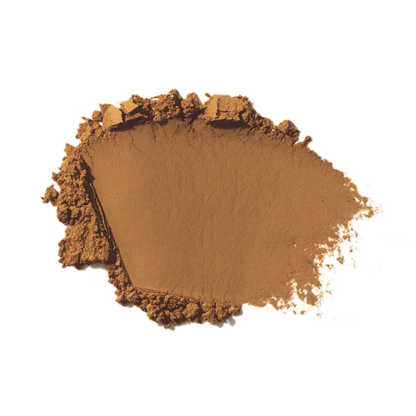 Brown makeup powder on a white background