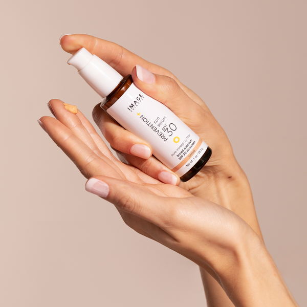 a model pouring the serum into their hand
